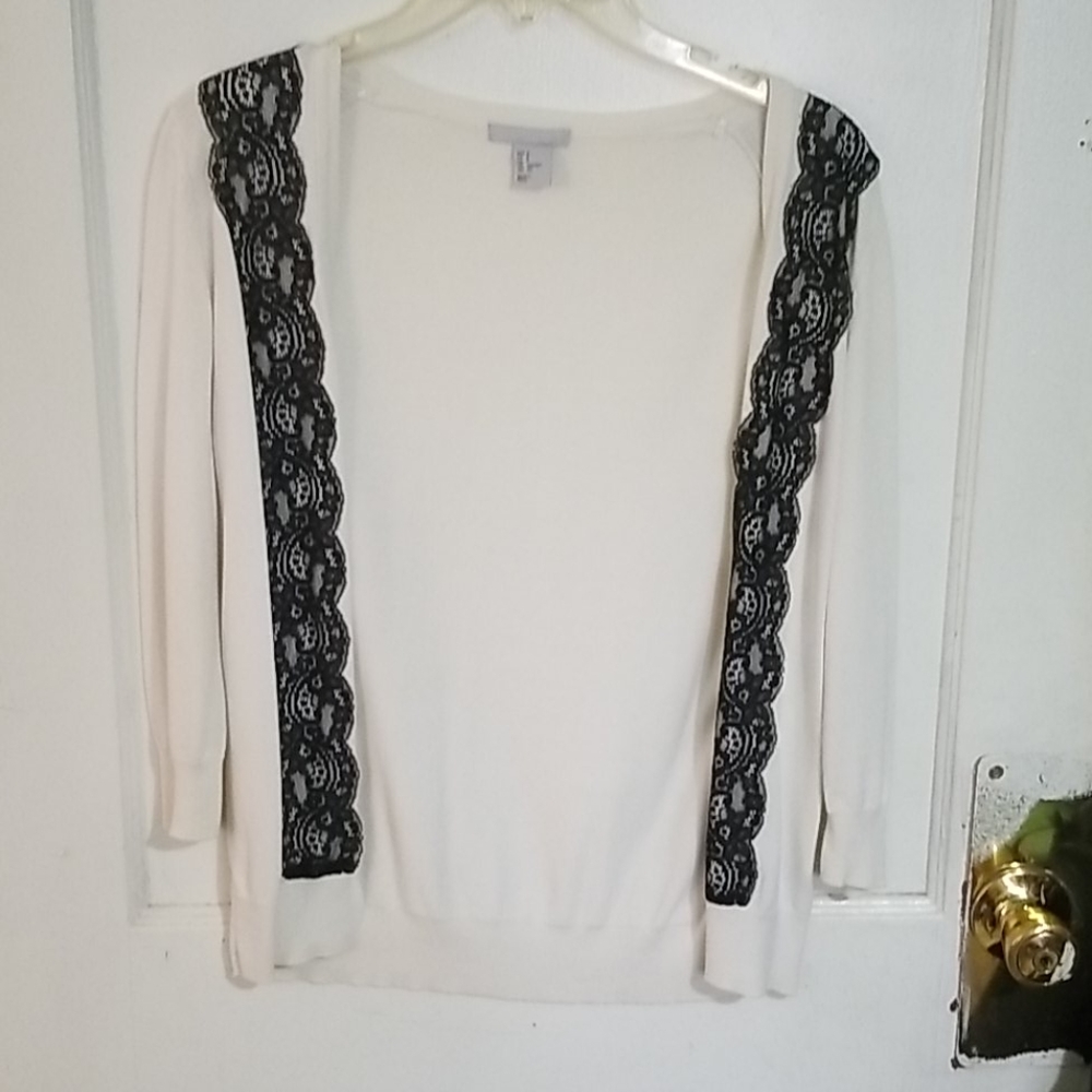 White cardigan with black lace design